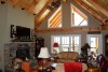 lake-cabin-living-room-with-vaulted-ceilings-and-stone-fireplace-wedowee-creek-680