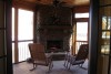 outdoor porch stone fireplace