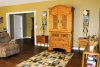 open-yellow-living-room-with-hardwood-floors