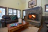 small cottage living room and stone fireplace