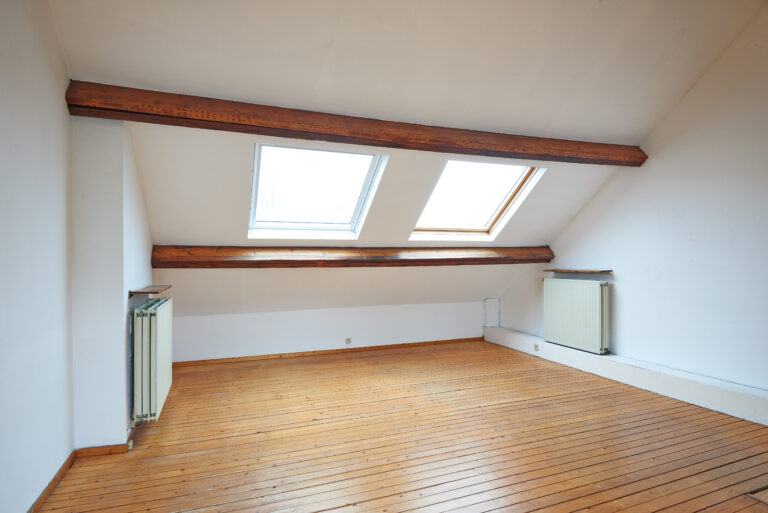 attic loft bedroom interior with windows
