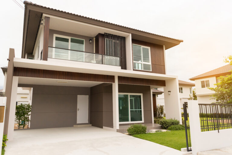 small house exterior with green lawn